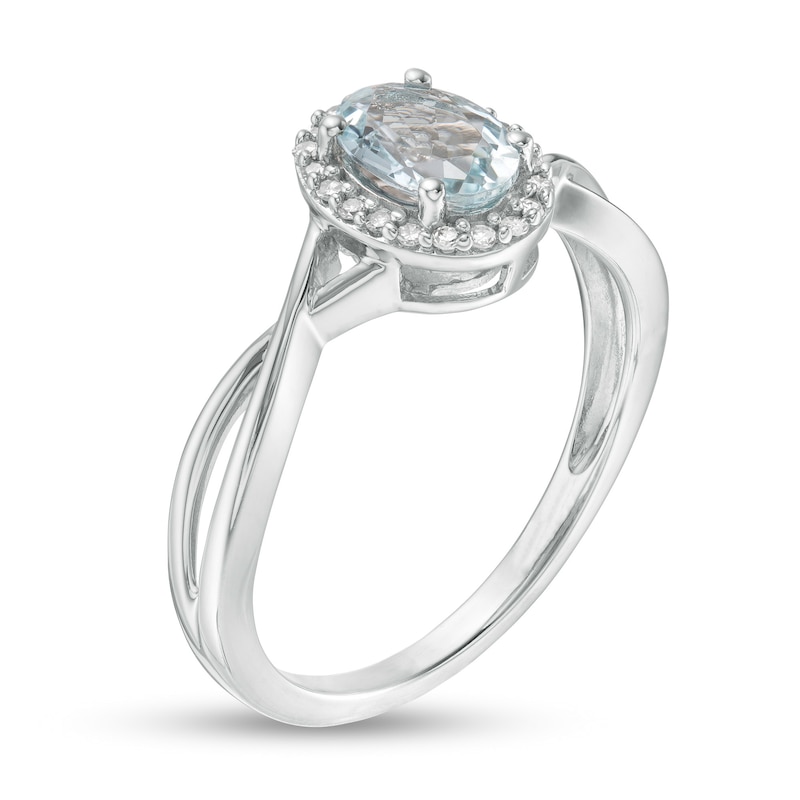 Oval Aquamarine and 1/15 CT. T.W. Diamond Frame Twist Shank Ring in 10K White Gold