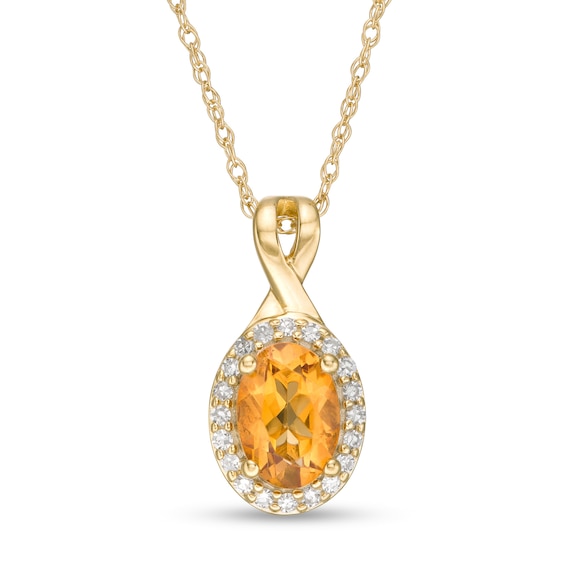 Oval Citrine and 1/15 CT. T.w. Diamond Frame Pendant in 10K Gold