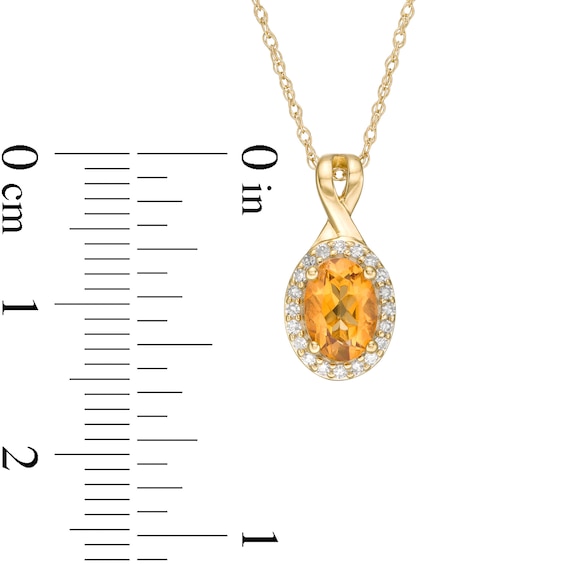 Oval Citrine and 1/15 CT. T.w. Diamond Frame Pendant in 10K Gold