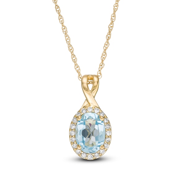 Oval Swiss Blue Topaz and 1/15 CT. T.w. Diamond Frame Pendant in 10K Gold