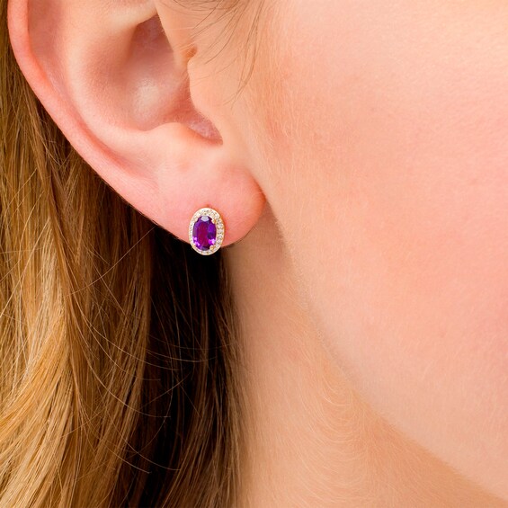 Oval Amethyst and 1/10 CT. T.w. Diamond Frame Stud Earrings in 10K Gold