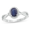 Thumbnail Image 0 of Oval Blue Sapphire and 1/15 CT. T.W. Diamond Frame Twist Shank Ring in 10K White Gold