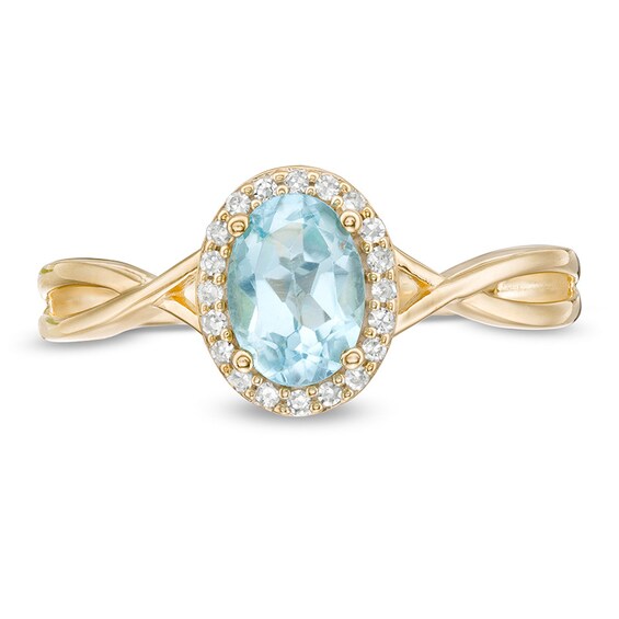 Oval Swiss Blue Topaz and 1/15 CT. T.w. Diamond Frame Twist Shank Ring in 10K Gold