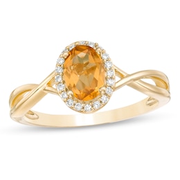 Oval Citrine and 1/15 CT. T.W. Diamond Frame Twist Shank Ring in 10K Gold