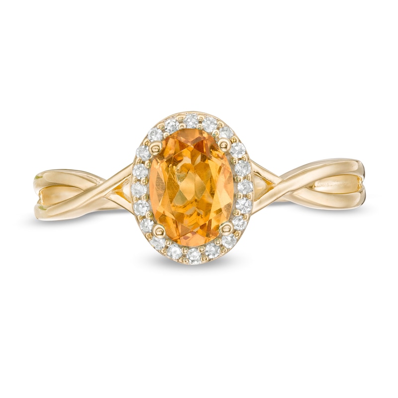 Oval Citrine and 1/15 CT. T.W. Diamond Frame Twist Shank Ring in 10K Gold