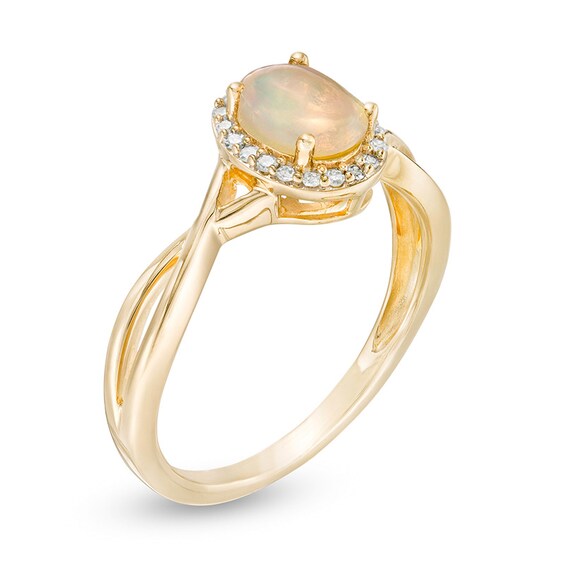 Oval Opal and 1/15 CT. T.w. Diamond Frame Twist Shank Ring in 10K Gold