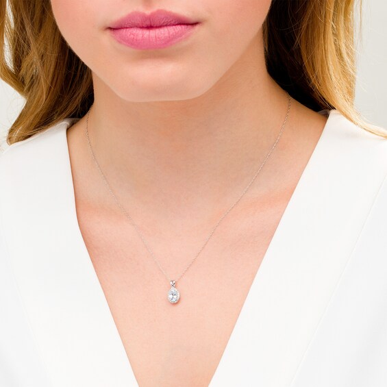 Oval Aquamarine and 1/15 CT. T.w. Diamond Frame Pendant in 10K White Gold