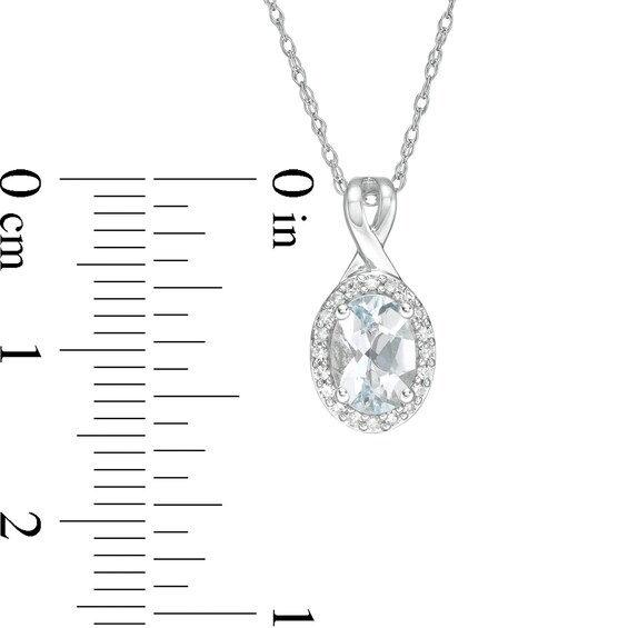 Oval Aquamarine and 1/15 CT. T.w. Diamond Frame Pendant in 10K White Gold