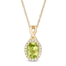 Oval Peridot and 1/15 CT. T.W. Diamond Frame Pendant in 10K Gold