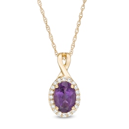 Oval Amethyst and 1/15 CT. T.W. Diamond Frame Pendant in 10K Gold