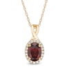 Thumbnail Image 1 of Oval Garnet and 1/15 CT. T.W. Diamond Frame Pendant in 10K Gold