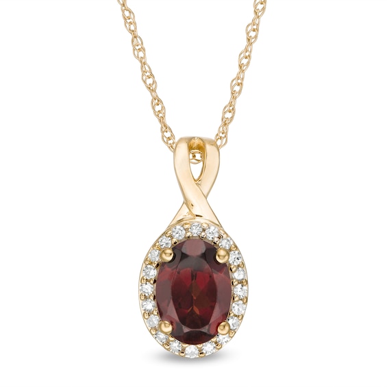 Oval Garnet and 1/15 CT. T.W. Diamond Frame Pendant in 10K Gold | Zales