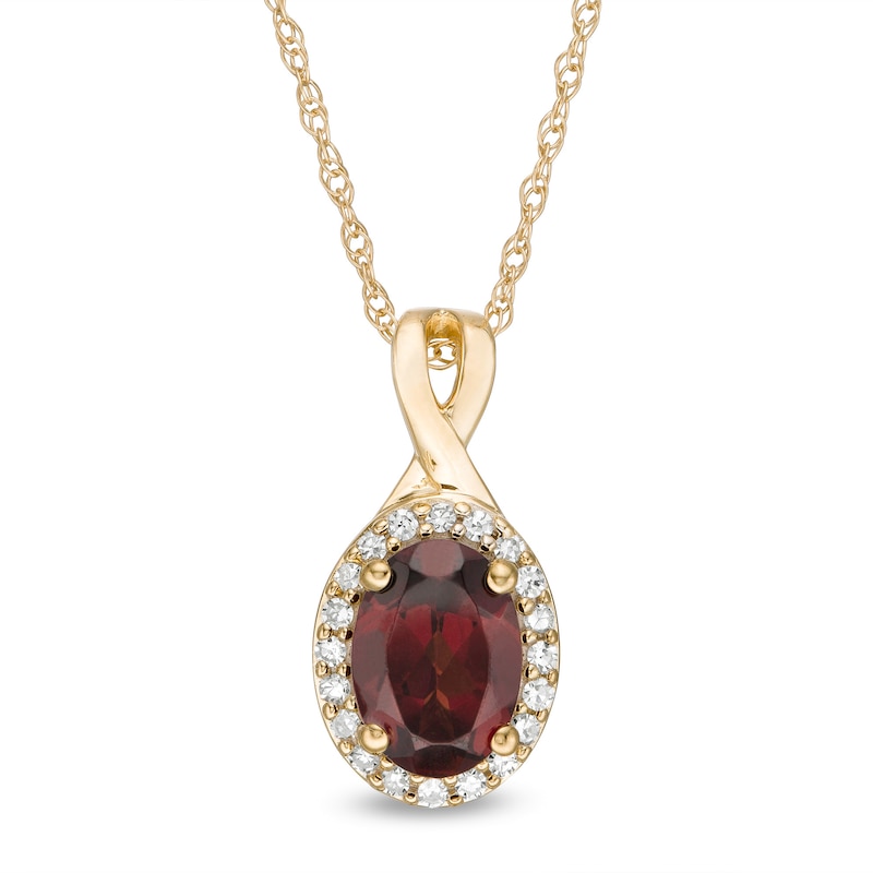 Main Image 1 of Oval Garnet and 1/15 CT. T.W. Diamond Frame Pendant in 10K Gold
