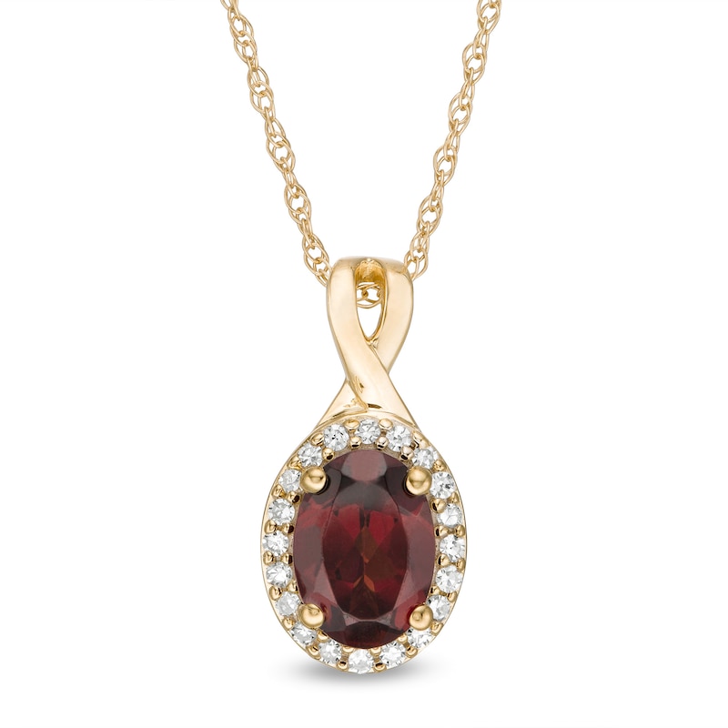 Oval Garnet and 1/15 CT. T.W. Diamond Frame Pendant in 10K Gold