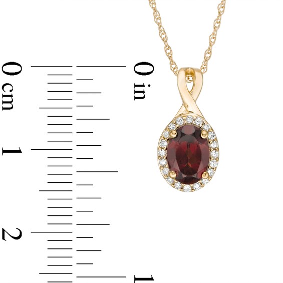 Oval Garnet and 1/15 CT. T.w. Diamond Frame Pendant in 10K Gold