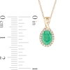 Thumbnail Image 2 of Oval Emerald and 1/15 CT. T.W. Diamond Frame Pendant in 10K Gold