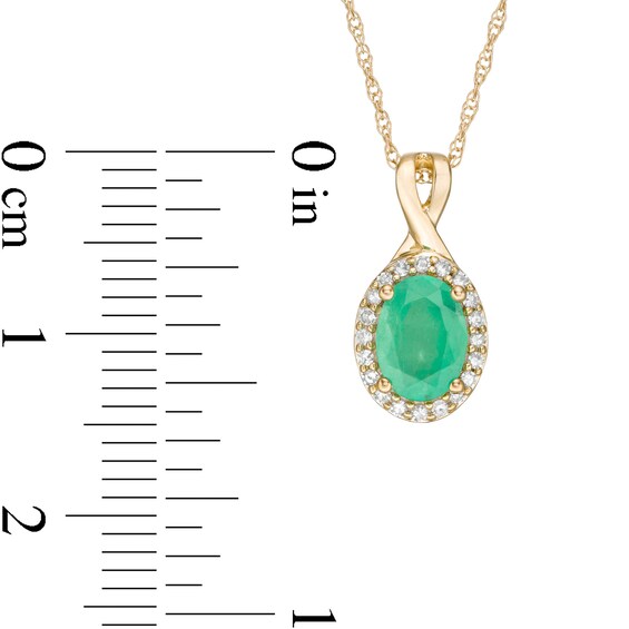 Oval Emerald and 1/15 CT. T.w. Diamond Frame Pendant in 10K Gold