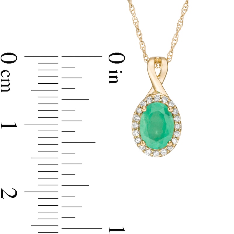 Oval Emerald and 1/15 CT. T.W. Diamond Frame Pendant in 10K Gold