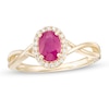 Thumbnail Image 1 of Oval Ruby and 1/15 CT. T.W. Diamond Frame Twist Shank Ring in 10K Gold