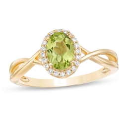 Oval Peridot and 1/15 CT. T.W. Diamond Frame Twist Shank Ring in 10K Gold