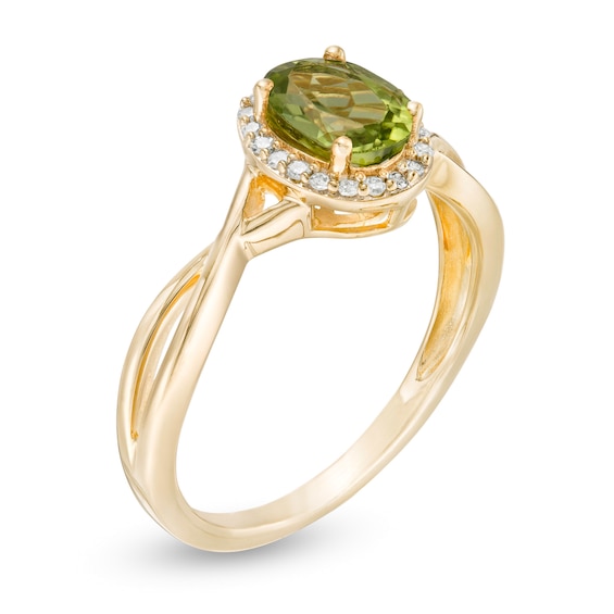 Oval Peridot and 1/15 CT. T.w. Diamond Frame Twist Shank Ring in 10K Gold