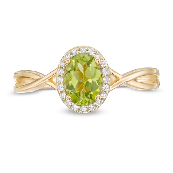Oval Peridot and 1/15 CT. T.w. Diamond Frame Twist Shank Ring in 10K Gold