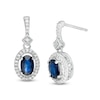 Thumbnail Image 1 of Oval Blue Sapphire and 1/5 CT. T.W. Diamond Frame Drop Earrings in 10K White Gold