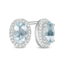 Oval Aquamarine and 1/10 CT. T.W. Diamond Frame Stud Earrings in 10K White Gold