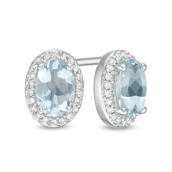 Oval Aquamarine and 1/10 CT. T.w. Diamond Frame Stud Earrings in 10K White Gold