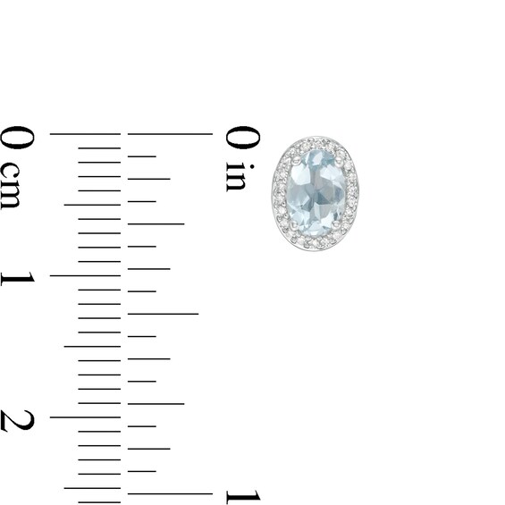 Oval Aquamarine and 1/10 CT. T.w. Diamond Frame Stud Earrings in 10K White Gold