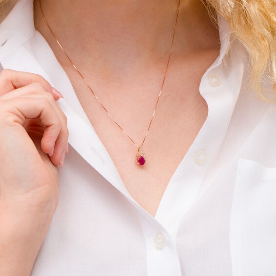 Pear-Shaped Ruby and 1/20 CT. T.W. Diamond Teardrop Pendant in 10K Rose Gold Pear-Shaped Ruby and 1/20 CT. T.W. Diamond Teardrop Pendant in 10K Rose Gold