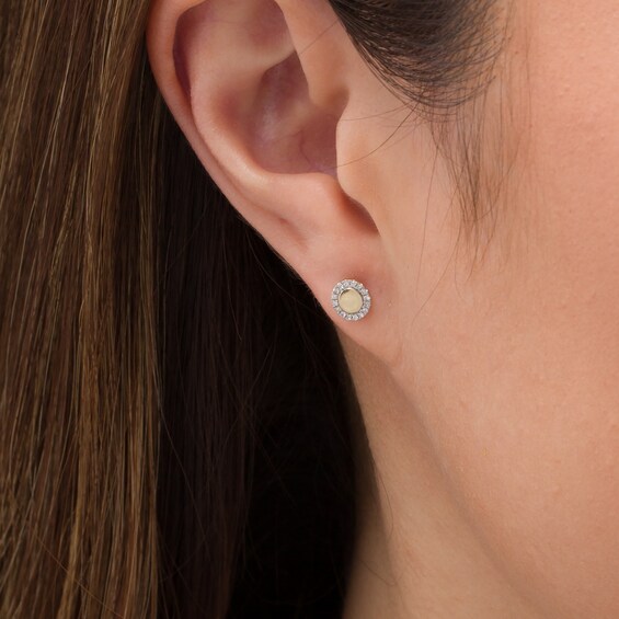 1/20 CT. T.w. Diamond Circle Frame Stud Earrings in 10K Gold