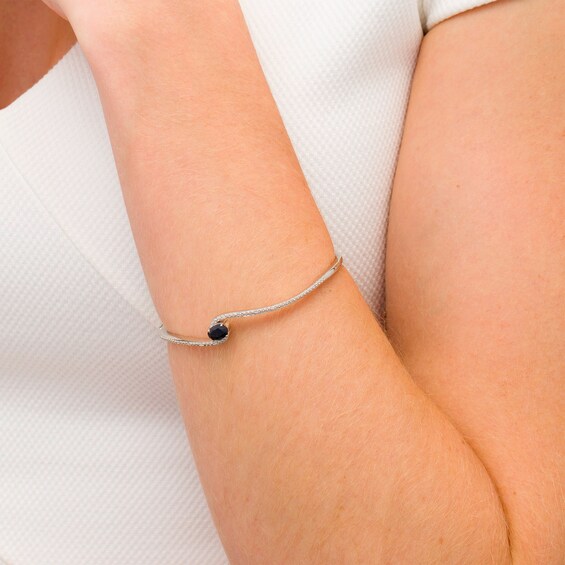 Oval Black Sapphire and 1/20 CT. T.w. Diamond Bypass Bangle in Sterling Silver