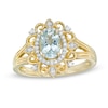 Thumbnail Image 1 of Oval Aquamarine and 1/10 CT. T.W. Diamond Frame Vintage-Style Ornate Ring in 10K Gold