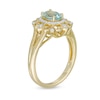 Oval Aquamarine and 1/10 CT. T.W. Diamond Frame Vintage-Style Ornate Ring in 10K Gold
