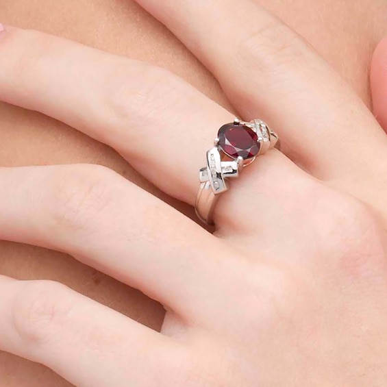 Oval Garnet and 1/10 CT. T.w. Diamond "X" Shank Ring in Sterling Silver
