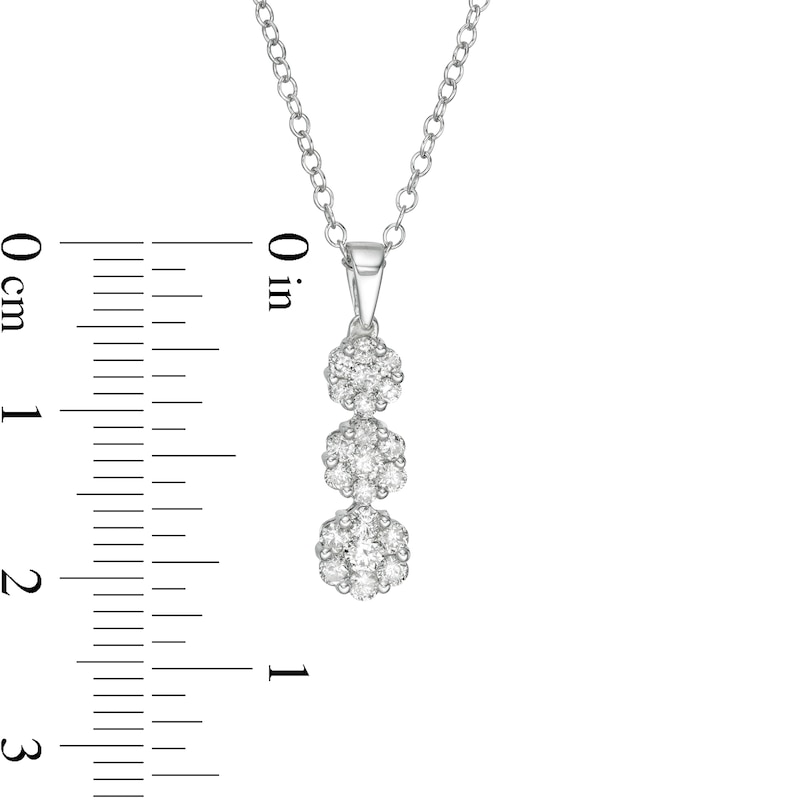 1/2 CT. T.W. Multi-Diamond Graduated Three Stone Flower Pendant in 10K White Gold