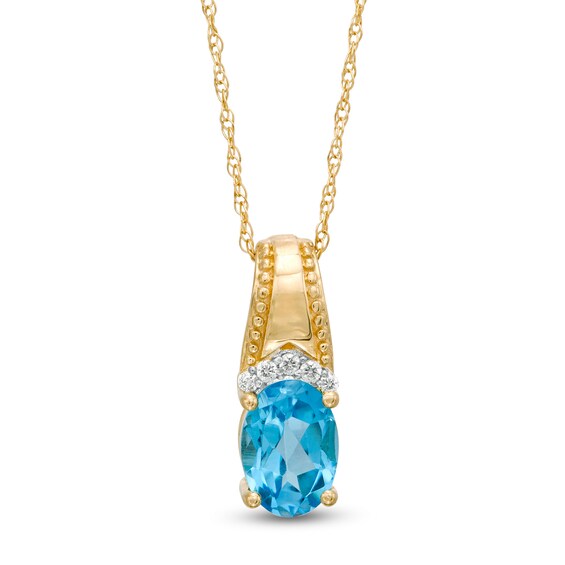 Oval Swiss Blue Topaz and Diamond Accent Beaded Drop Pendant in 10K Gold