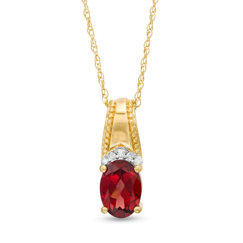 Main Image 1 of Oval Garnet and Diamond Accent Beaded Drop Pendant in 10K Gold