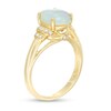 Oval Opal and 1/10 CT. T.W. Diamond Double Stepped Shank Ring in 10K Gold