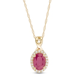 Oval Ruby and 1/15 CT. T.W. Diamond Frame Pendant in 10K Gold