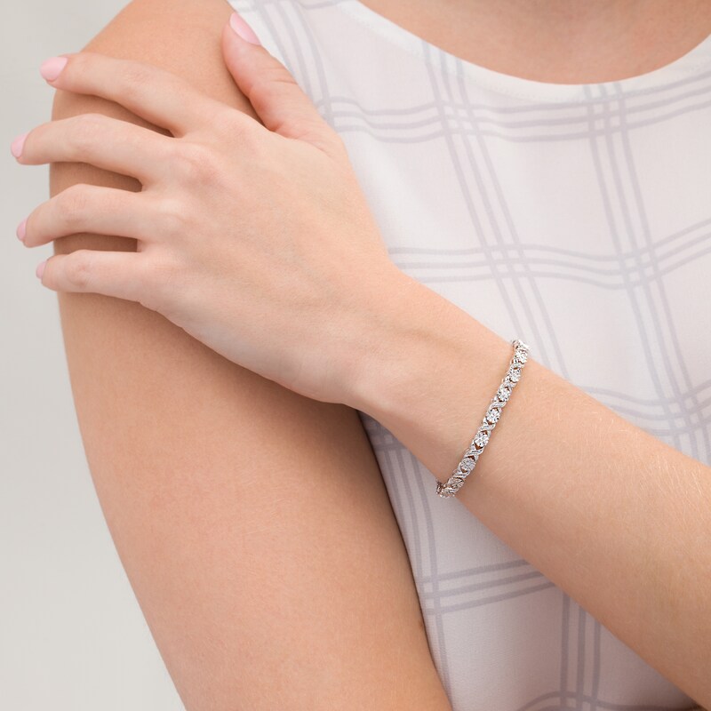 Main Image 2 of 1/4 CT. T.W. Diamond Floral "XO" Link Bracelet in Sterling Silver - 7.25"