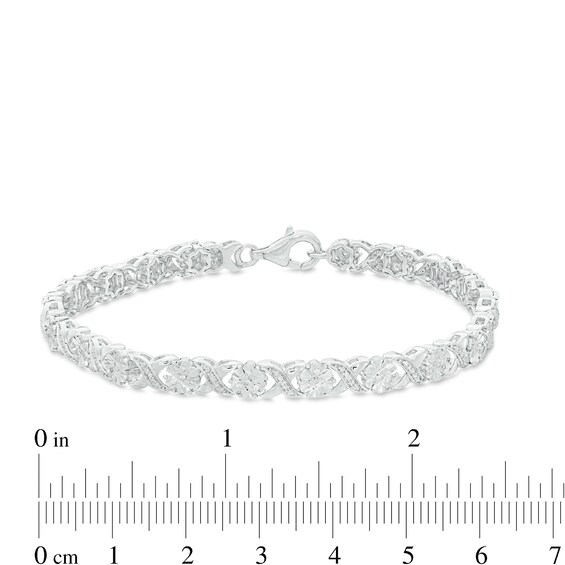 1/4 CT. T.w. Diamond Floral "Xo" Link Bracelet in Sterling Silver - 7.25"