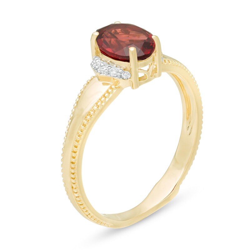 Main Image 3 of Oval Garnet and 1/20 CT. T.W. Diamond Collar Frame Vintage-Style Ring in 10K Gold