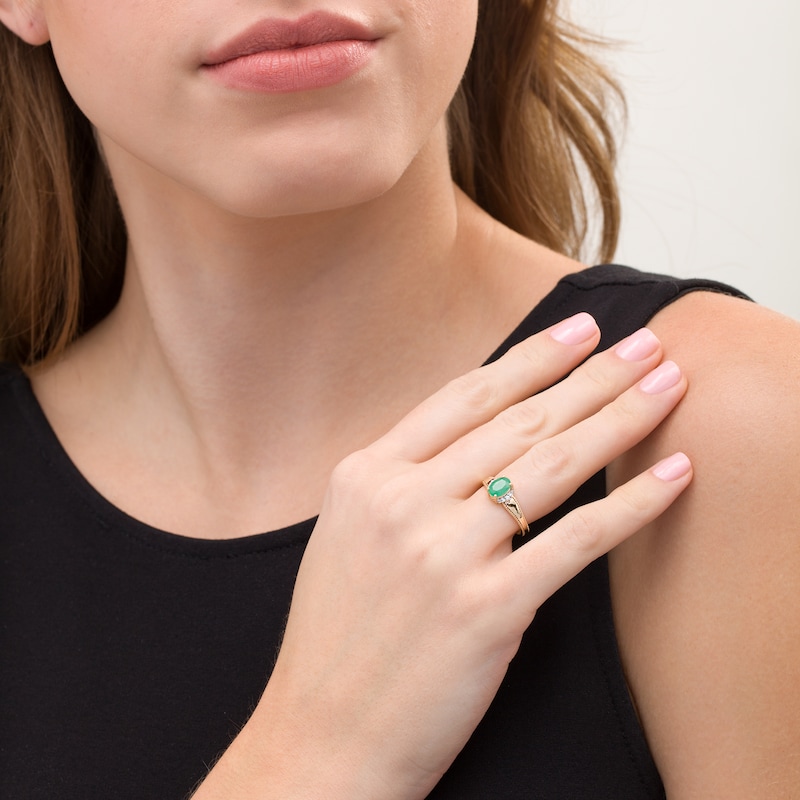 Main Image 2 of Oval Emerald and 1/20 CT. T.W. Diamond Collar Frame Vintage-Style Ring in 10K Gold
