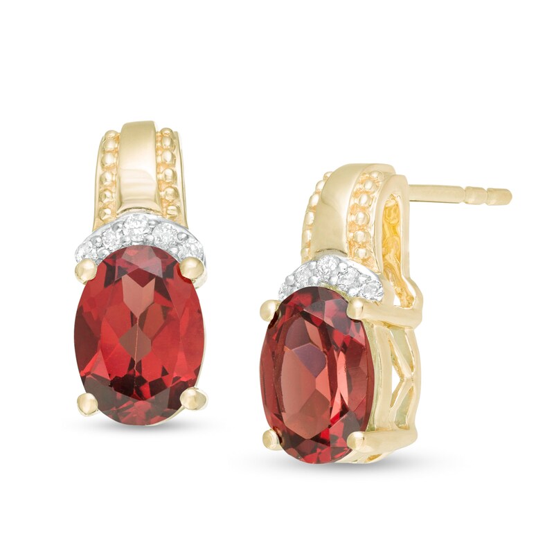 Main Image 1 of Oval Garnet and 1/20 CT. T.W. Diamond Beaded Drop Earrings in 10K Gold