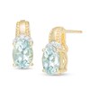 Thumbnail Image 0 of Oval Aquamarine and 1/20 CT. T.W. Diamond Beaded Drop Earrings in 10K Gold