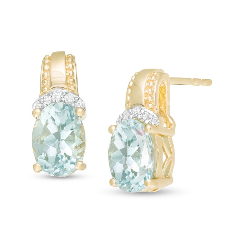 Oval Aquamarine and 1/20 CT. T.W. Diamond Beaded Drop Earrings in 10K Gold