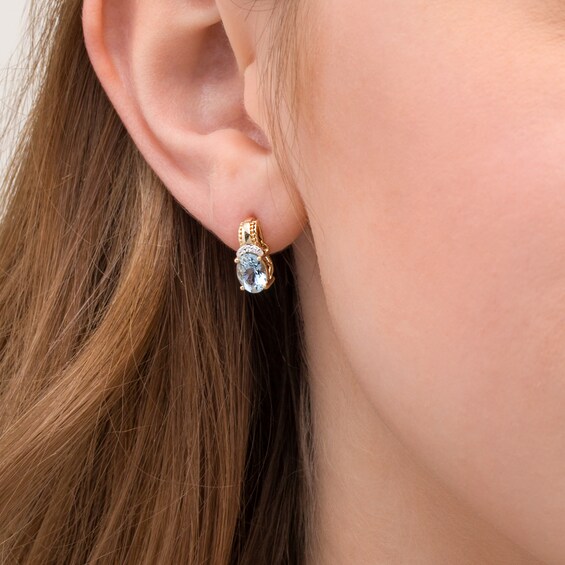 Oval Aquamarine and 1/20 CT. T.w. Diamond Beaded Drop Earrings in 10K Gold