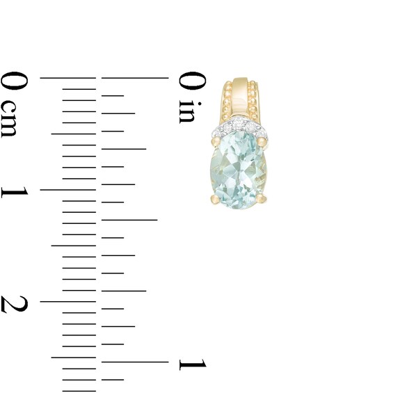 Oval Aquamarine and 1/20 CT. T.w. Diamond Beaded Drop Earrings in 10K Gold